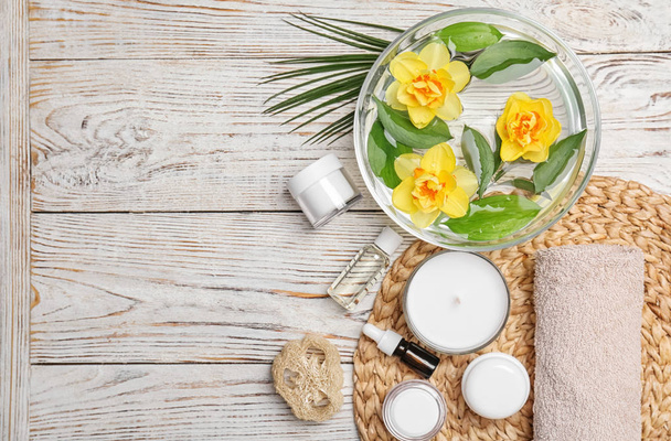 Composition with spa accessories and flowers on wooden background - Valokuva, kuva
