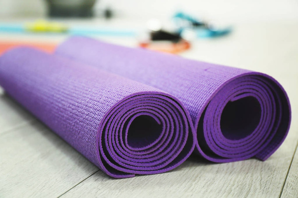 Rolled yoga mats indoors, closeup. Physiotherapy center - Φωτογραφία, εικόνα