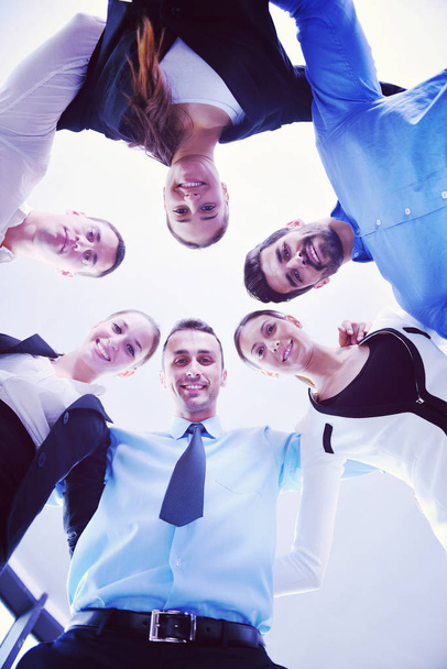 business people group joining hands and representing concept of friendship and teamwork,  low angle view - Fotografie, Obrázek