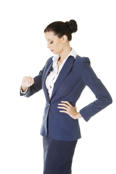 Attractive businesswoman checking time - Photo, Image