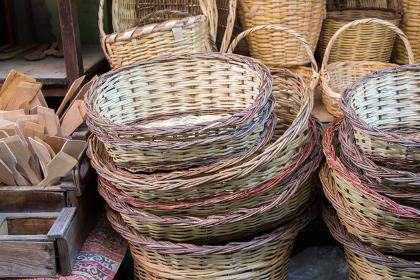 Empty wicker baskets are for sale in a market - Photo, Image