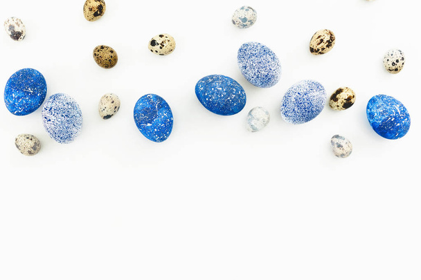 Blue Speckled Easter Eggs with quail eggs on white background. Flat lay. Top view.  - Zdjęcie, obraz