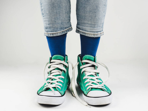 Stylish sneakers and funny, happy socks - Foto, imagen