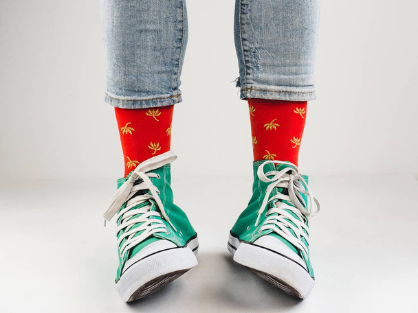 Stylish sneakers and funny, happy socks - Foto, Bild