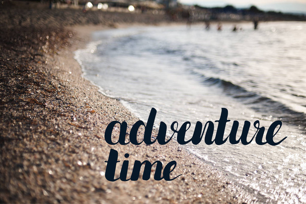 Adventure time lettering words on photo seeshore background  - Valokuva, kuva