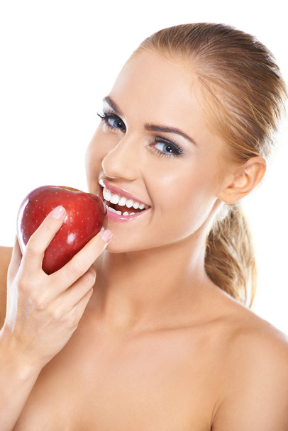 Laughing woman with a red apple - Foto, Imagem