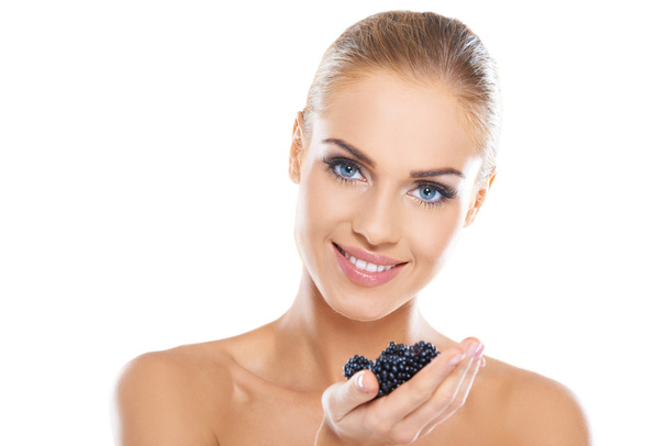 Smiling healthy woman with blackberries - Фото, изображение