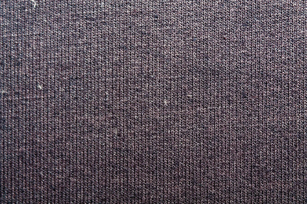 Темно-фиолетовый фон из текстильного материала с плетеным крупным планом. Структура синей морской ткани с натуральной текстурой. Фон для одежды
. - Фото, изображение