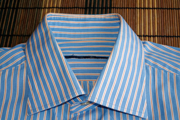 Onderdeel van blauwe gestreepte shirt textuur of achtergrond - Foto, afbeelding