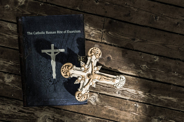 exorcism book on wooden floor - Photo, Image