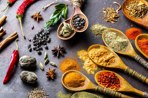 Spices for cooking with kitchen accessories on an old background - Fotografie, Obrázek