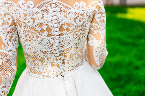 closeup of the bride's back. beautiful lace on the back - Foto, immagini
