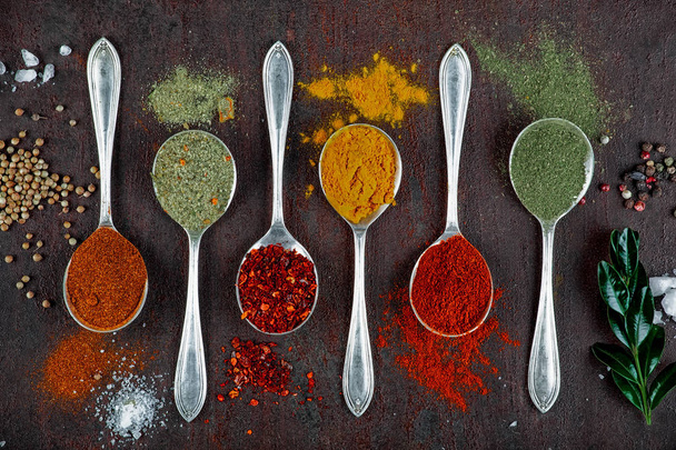 Spices for cooking with kitchen accessories on an old background - Foto, Imagen