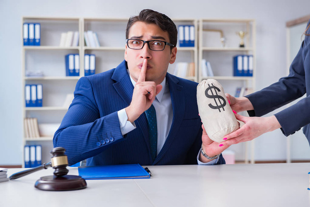 Judge in bribe concept with money - Фото, изображение
