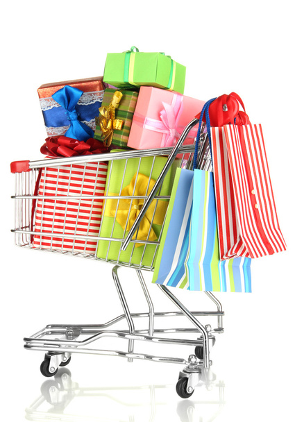 Christmas gifts and shopping in trolley isolated on white - Foto, Bild