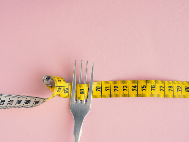 Measuring tape with a steel fork - 写真・画像