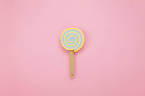 Table top view shot of arrangement food object background concept.Flat lay of sweet candy on the modern rustic pink paper at home office desk wallpaper.pastel tone creative design. - Photo, Image