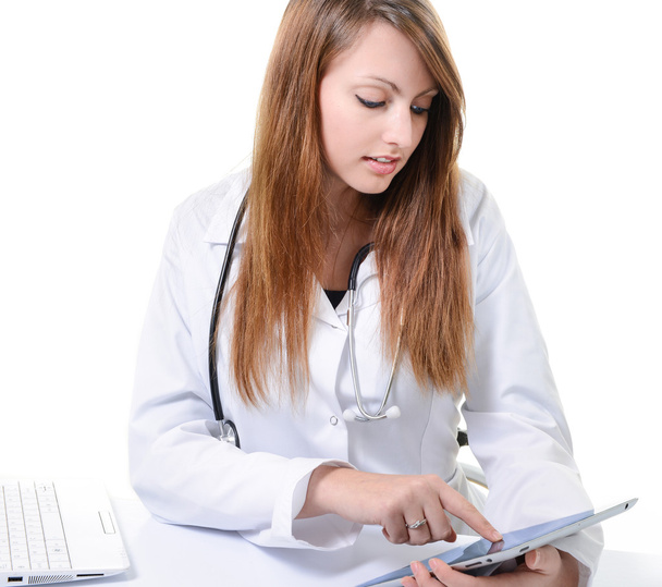Female student doctor working with digital tablet - 写真・画像