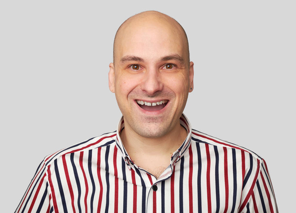 Cheerful bald guy smiles happily isolated - Foto, Imagen