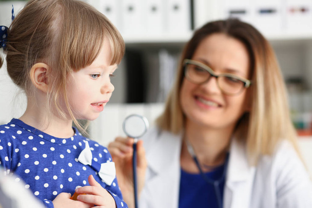 Little child with stethoscope at doctor reception - Photo, Image