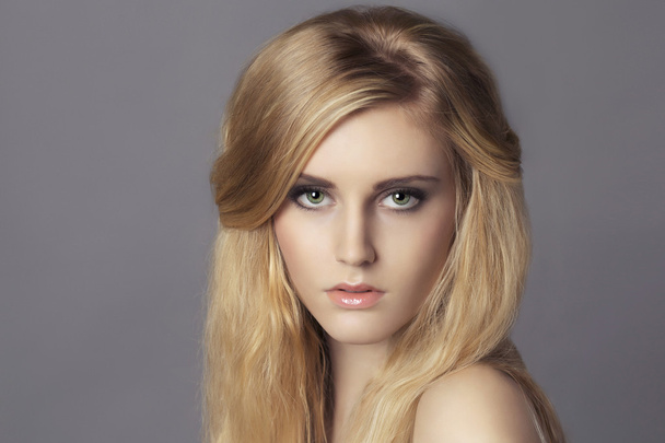 Portrait of young beautiful blond woman - Fotó, kép