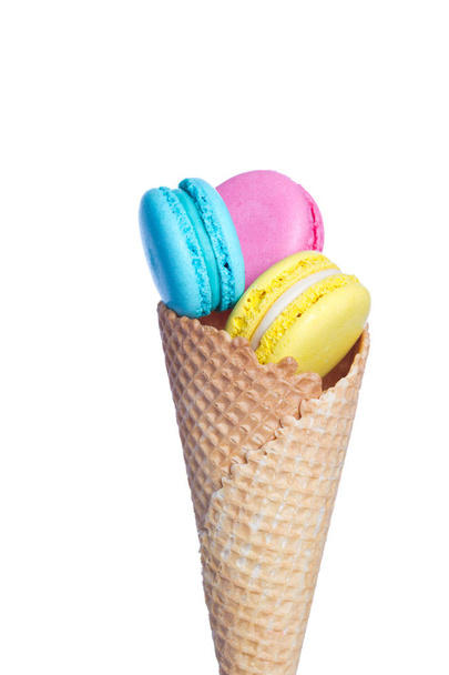 Almond cookies in waffle cone on white background. - Photo, image
