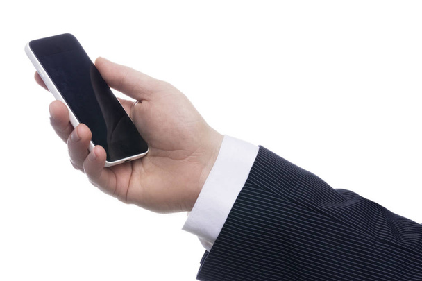 Imagen recortada de un hombre de traje sosteniendo el teléfono móvil sobre fondo blanco
 - Foto, Imagen