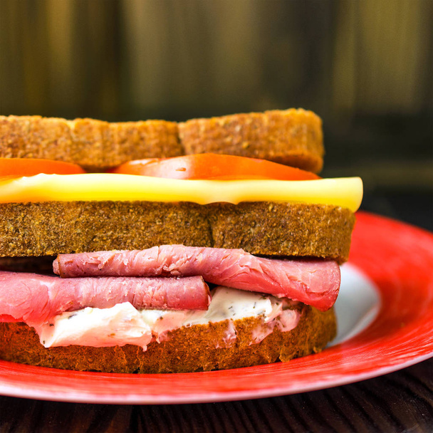 Homemade sandwiches with ham, cheese and tomatoes on a white pla - Photo, Image