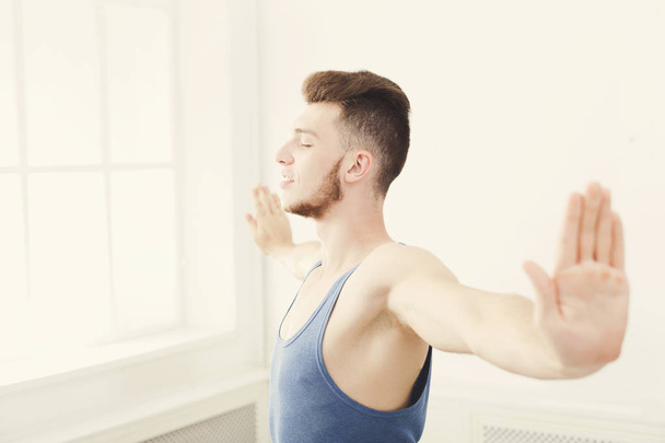 Man training yoga pose, copy space - Fotoğraf, Görsel