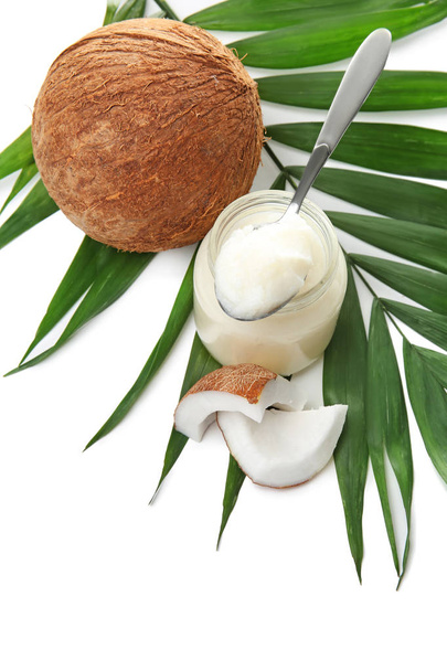 Beautiful composition with coconut oil and nuts on white background - Photo, image