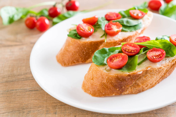 bread with rocket and tomatoes  - Photo, Image