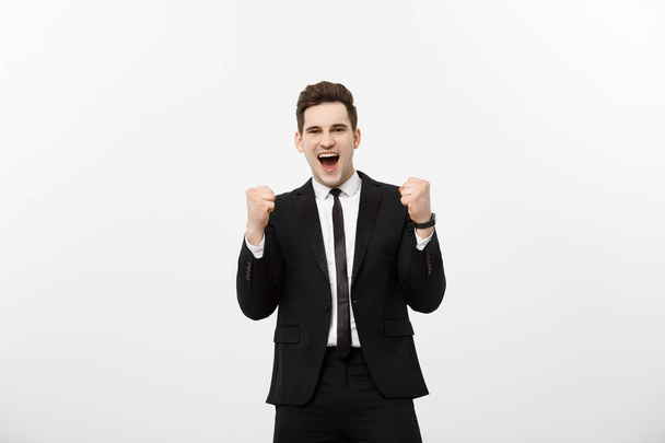 Business Concept: Portrait handsome businessman expressing surprise and joy raising his hands, isolated over white background. - Zdjęcie, obraz