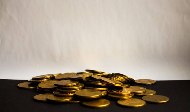 pouch of gold coins on white background - 写真・画像