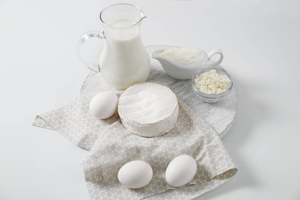Different dairy products and eggs on white background - Photo, image