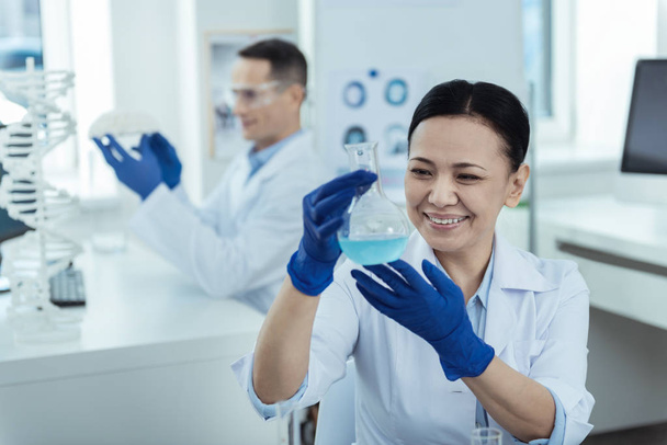 Cheerful researcher making a test in the lab - Φωτογραφία, εικόνα