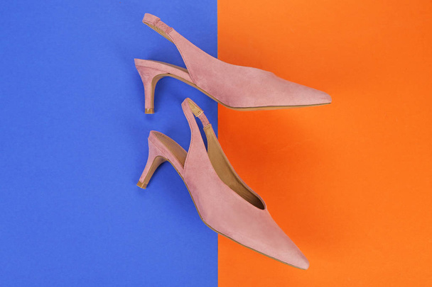 Elegant female shoes on color background - Фото, зображення