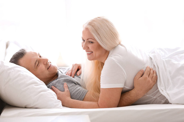 Senior couple in bed together at home - Foto, Imagem