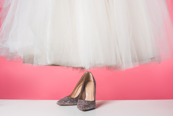 pair of shoes and wedding dress isolated on pink - Fotoğraf, Görsel
