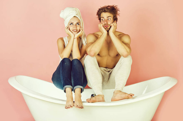 young beautiful couple in love sitting on bath - Фото, изображение