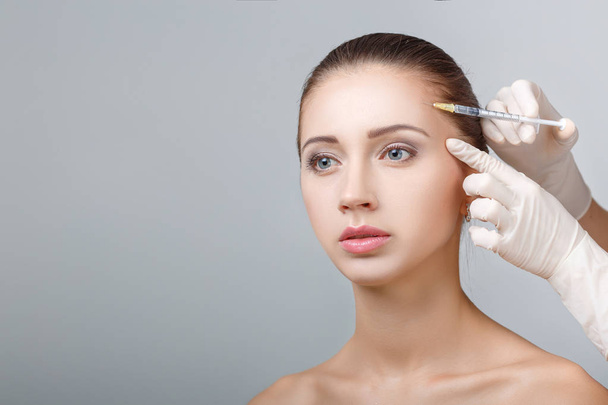 woman getting cosmetic injection - Photo, image
