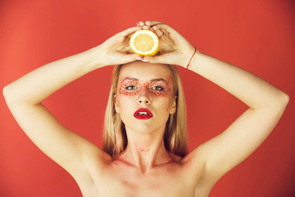 woman with creative fashionable makeup hold lemon, vitamin - Foto, Imagen