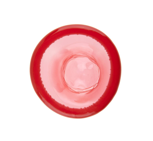 Preservativo vermelho isolado no fundo branco
 - Foto, Imagem