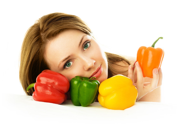 Young woman with peppers - Foto, Imagen