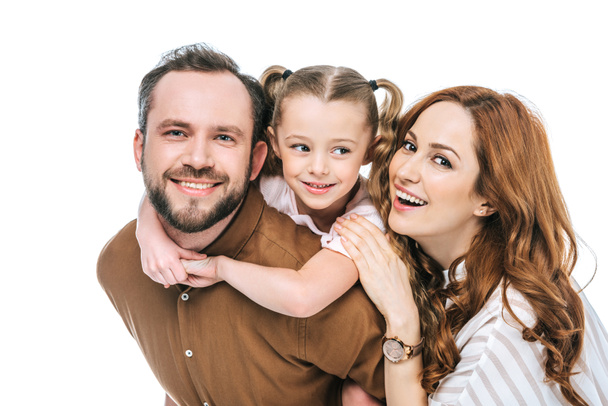 happy parents with adorable little daughter smiling at camera isolated on white - Photo, Image