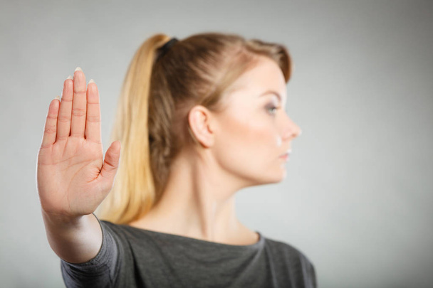 Assertive woman making stop gesture. - Foto, afbeelding