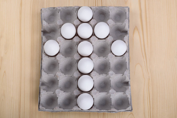 White chicken eggs as an arrow - 写真・画像