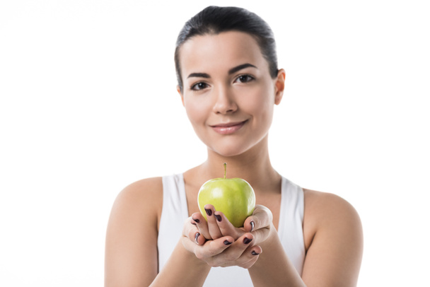 beautiful girl holding ripe apple isolated on white - Fotó, kép