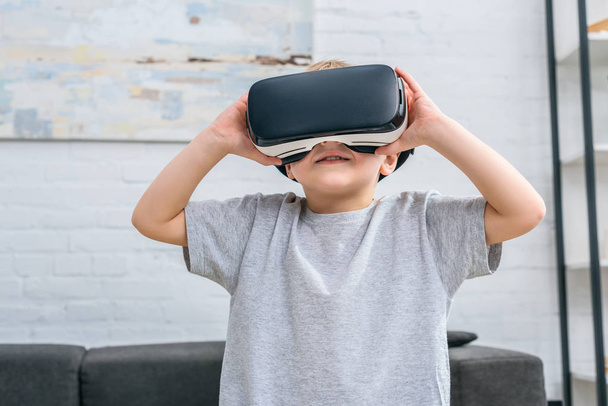 Little boy using virtual reality headset  - Fotó, kép