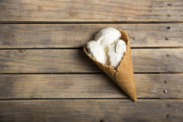Variety of ice cream scoops in cones with chocolate, vanilla and strawberry - Φωτογραφία, εικόνα