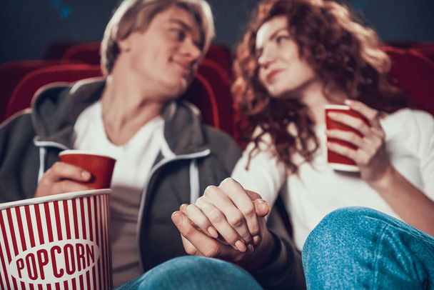 Guy and woman are sitting and watching a movie - Foto, immagini